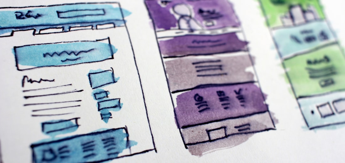 Designer sketching wireframes and page structure before build