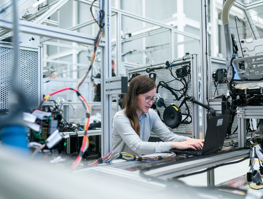 Engineer inspecting components on a factory floor